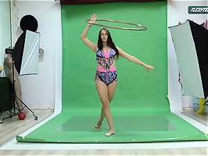 large breasts Nicole on the green screen stretching